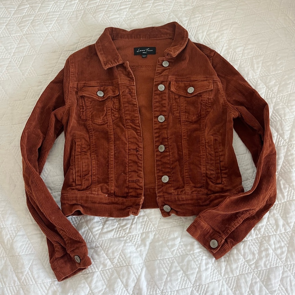 Small orange cropped jean jacket.